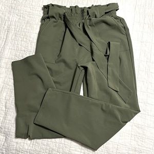 Green paper bag, straight leg pants size medium.